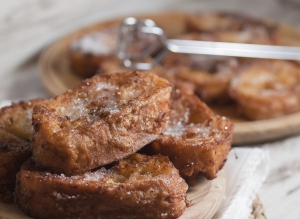 French toasts on a wooden plate. A delicious meal.